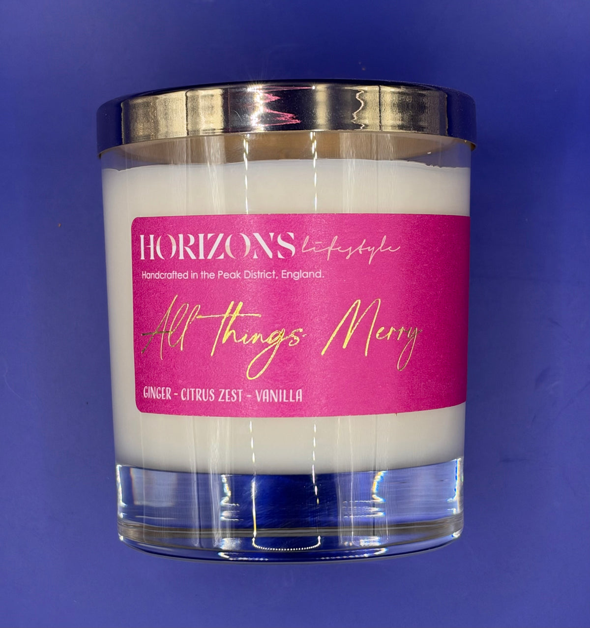 All things Merry glass candle